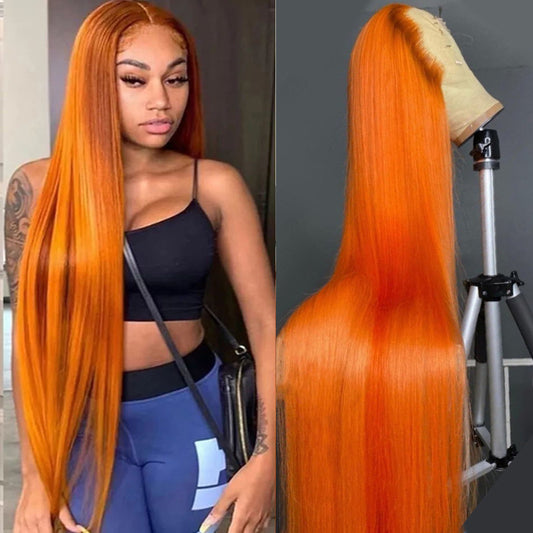 Person with long orange hair next to a wig on a mannequin head.